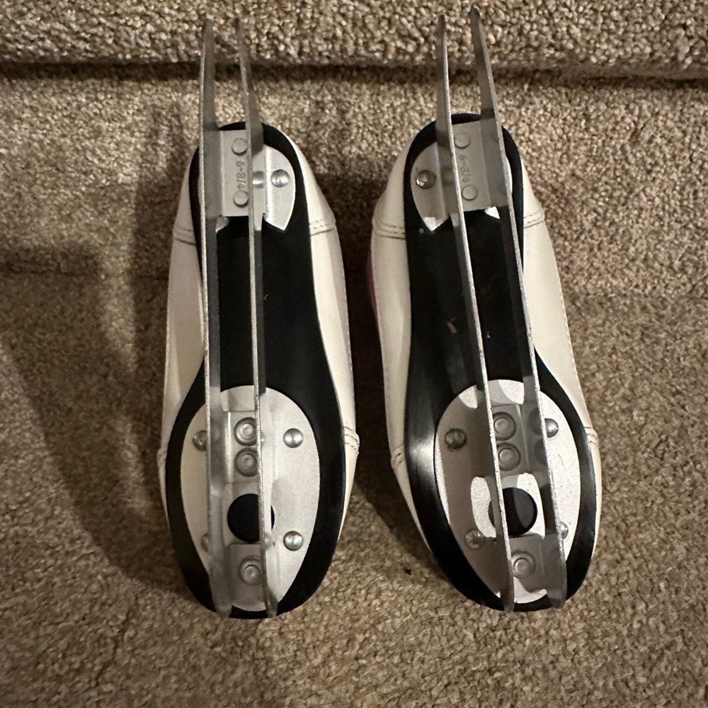 Sleek Black and White Cycling Shoes with Cleat System